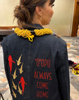 Back of The Returning Blazer with gold and red 'o'opu and the words 'O'opu Always Come Home